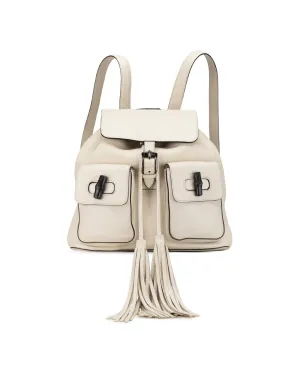 Leather Backpack with Bamboo Handle and Tassel Drawstring Closure