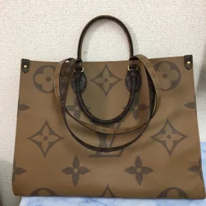 Louis Vuitton On The Go MM Coated Canvas Tote Bag,Brown